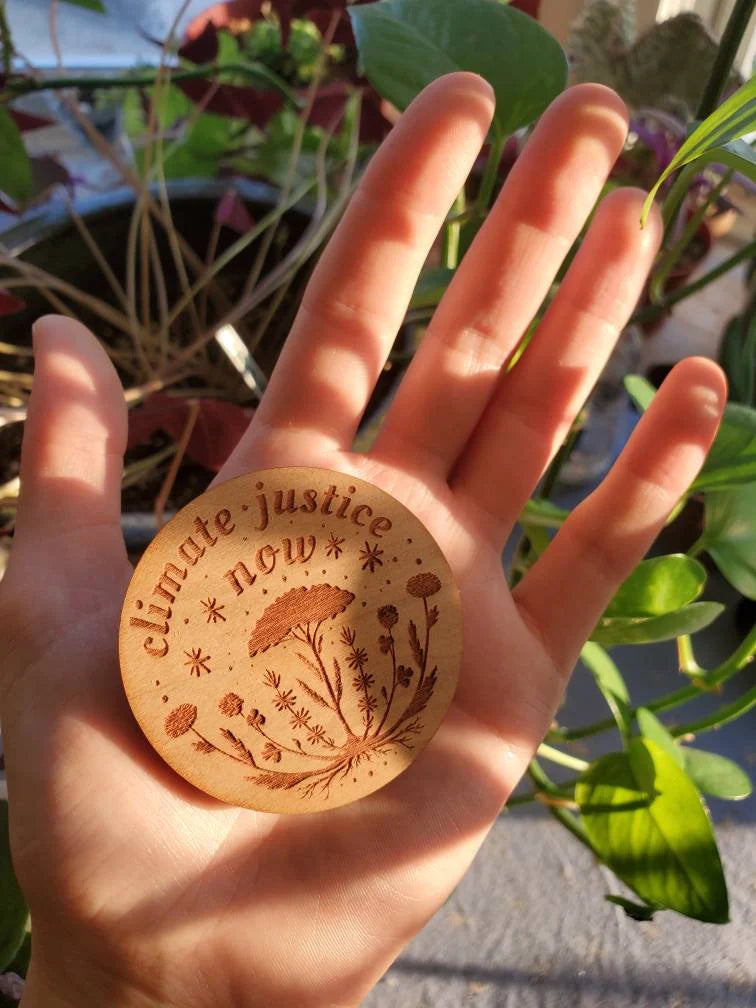 Climate Justice Now Wooden Pin - Cyclical Roots & Cycles Journal – Healing tools & grounding guides for self-awareness & collective wellbeing